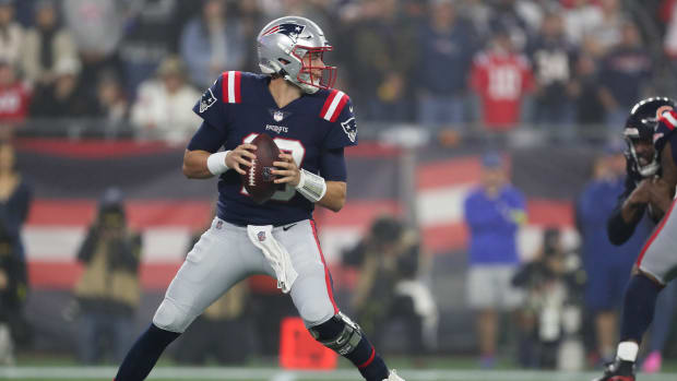 New England Patriots quarterback Mac Jones (10) drops back to pass during the first half against the Chicago Bears at Gillette Stadium.